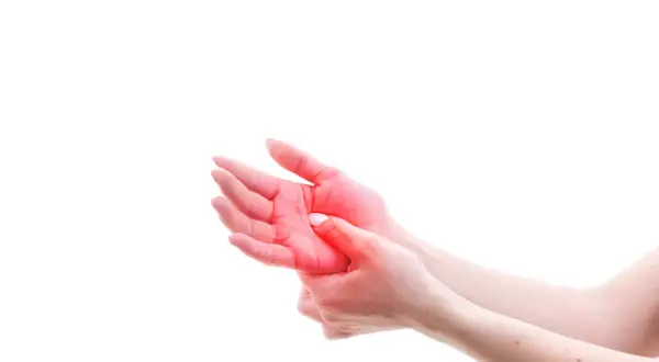 Close-up of hands with red highlighting on the palm, indicating pain or discomfort.